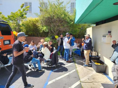 Drywall crew huddled in the corner, hiding the beer.  